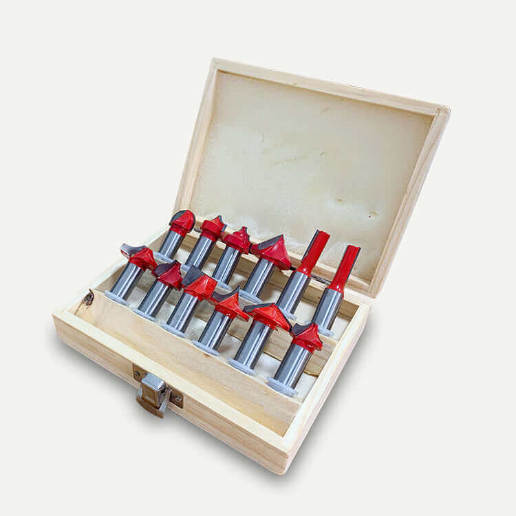 Woodworking router bit set in a wooden box with various red-tipped bits, ideal for precise cutting and shaping tasks.