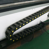 CNC router machine with oscillating knife for precise cutting, featuring a cable drag chain system, ideal for wood, fabric, and rubber.