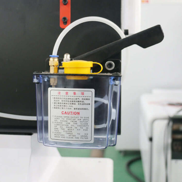 CNC router with oscillating knife attachment for cutting wood, fabric, and rubber. Features clear safety notice and ergonomic handle.