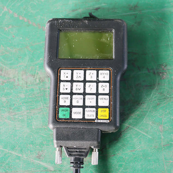 Control panel for High-Precision Mini CNC Router used in metal milling with LCD screen and keypad on green surface