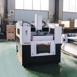 High-Precision Mini CNC Router for Metal Milling with water cooling spindle in an industrial setting